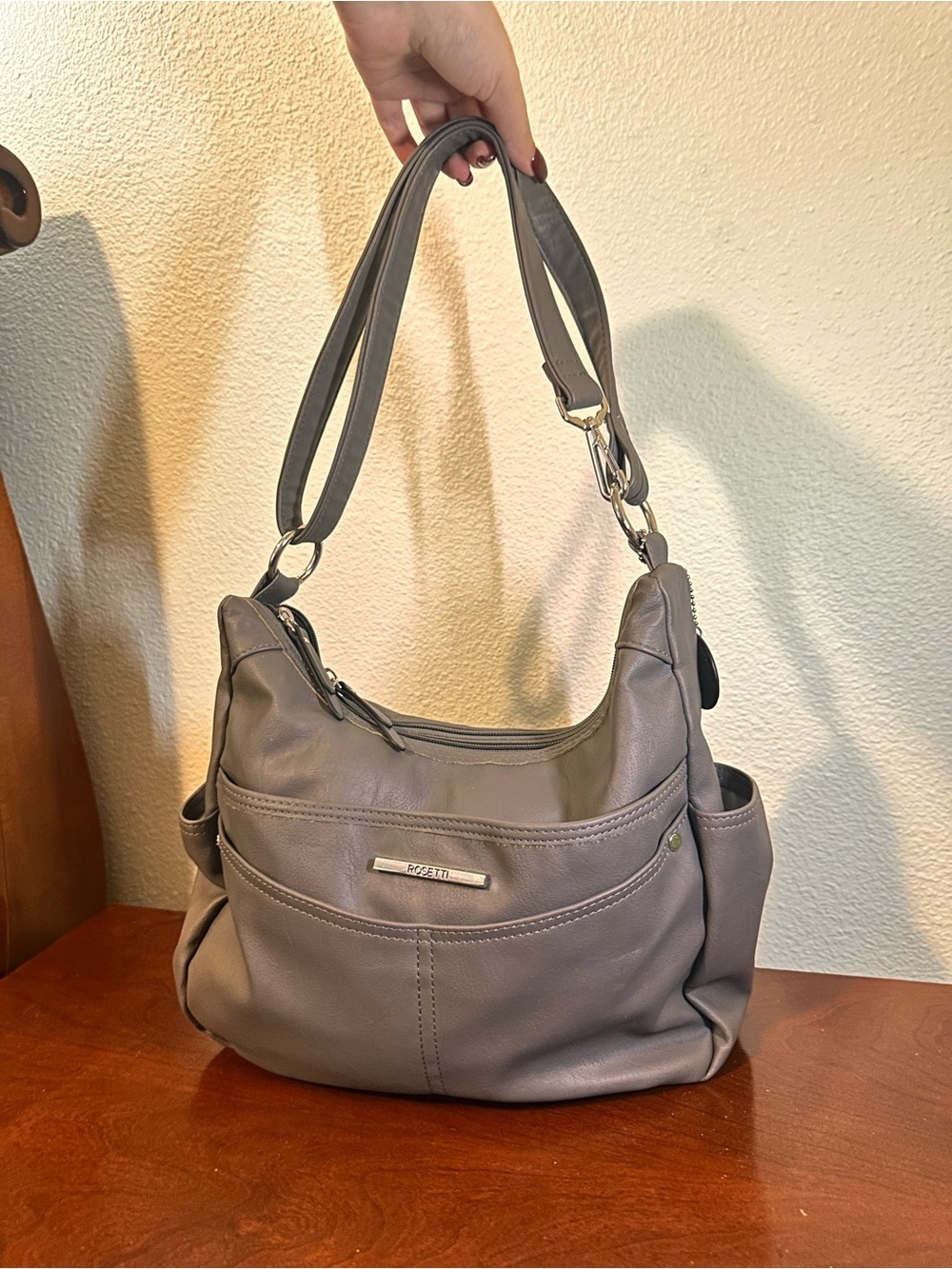 Gray leather Rosetti Dylan handbag with adjustable strap